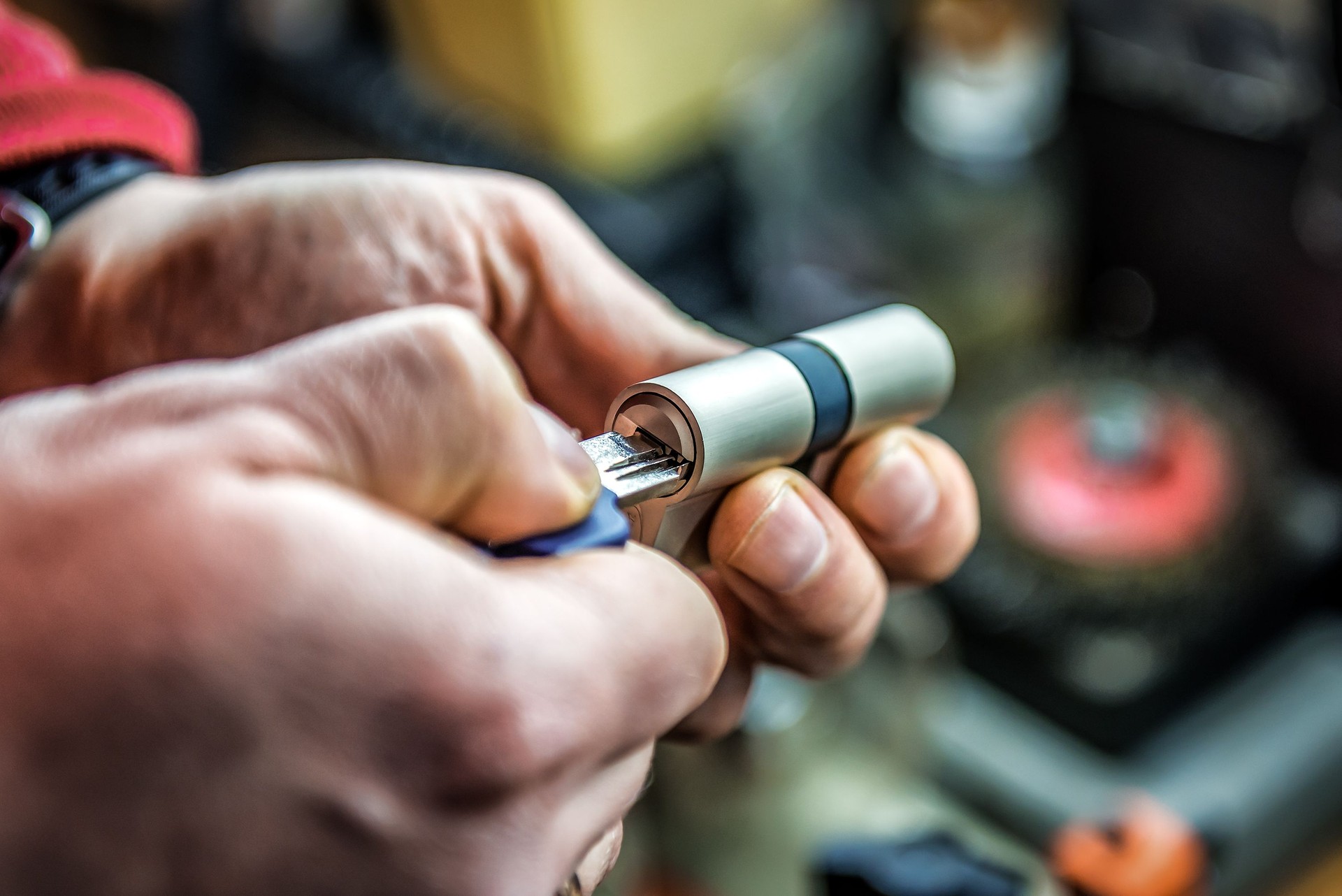 Testing door lock cylinder with key. Locksmith theme